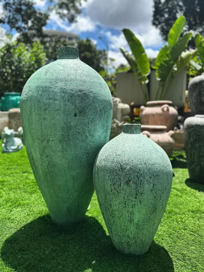 A pair of my ethereal 'Kembung' vases, their color enhanced by the bright green grass.