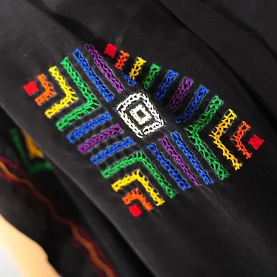 A memory of a past creation, this piece features a vibrant, multi-colored geometric pattern typical of Lambani or Banjara embroidery.