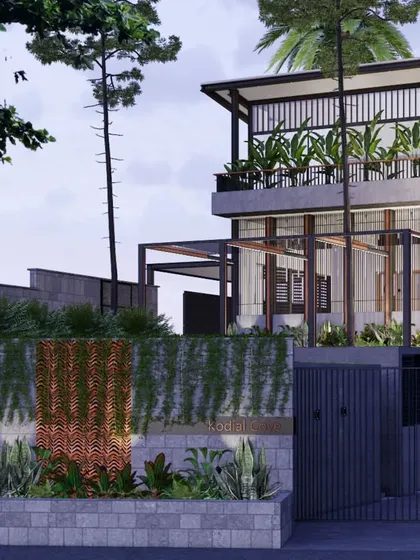 This perspective highlights the home's strong connection to its landscape. The elevated structure, open terraces, and extensive use of glass create a sense of lightness and transparency, while the stone wall grounds the building.