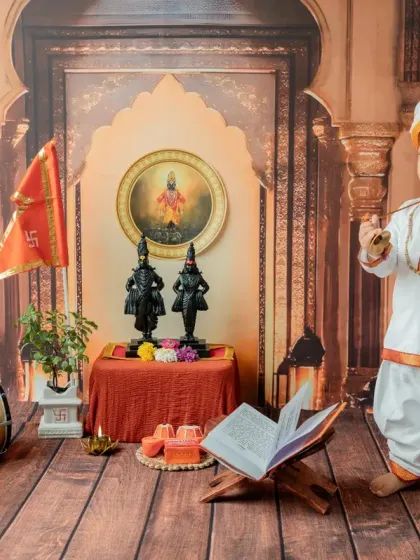 Capturing the baby's profile as he stands amidst the traditional props, creating a thoughtful and artistic portrait.