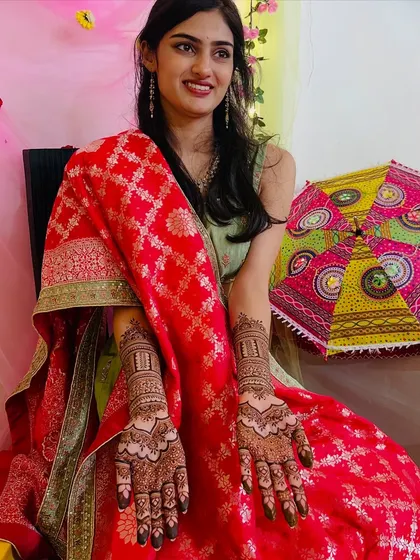 Seeing my clients happy is the best part of my work. Here is a beautiful bride-to-be, glowing during her mehendi ceremony, showcasing the full design that we created together for her special day.
