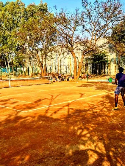 Players engaged in a competitive practice match on our well maintained clay courts.
