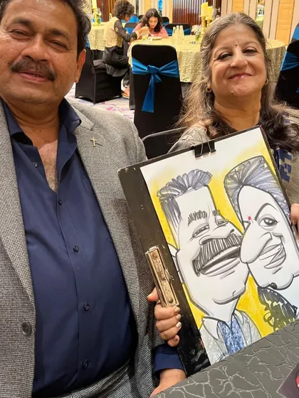 Another couple from the same event, with a caricature that captures their likeness in a fun, cartoonish way.