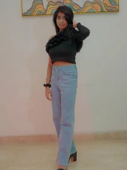 A full-length indoor shot showcasing a modern, casual fashion look. This type of photo is great for building a versatile modeling portfolio that includes western wear.