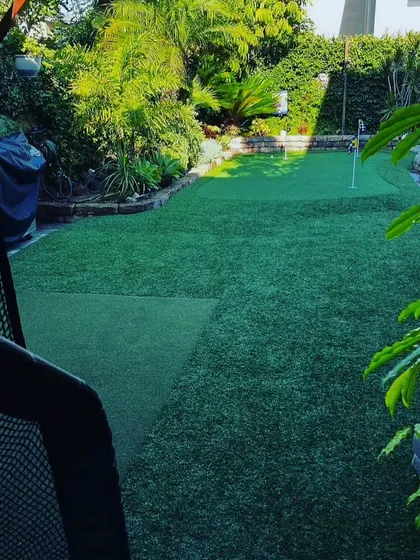Even in a more compact backyard, I can install a functional putting green. This setup is perfect for daily practice and fits neatly into a fenced-in area.