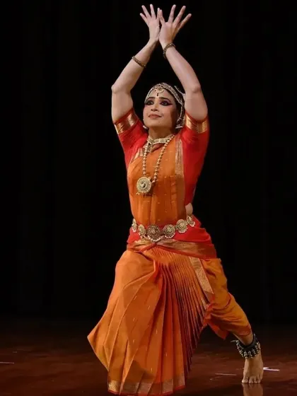 The grace and form of a classic Bharatanatyam pose. My choreography emphasizes sharp, clean lines and a strong stage presence, rooted in traditional technique.