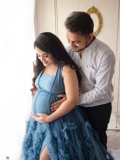 A close-up shot focusing on the baby bump. These intimate photos beautifully capture the anticipation and love of waiting for your baby.