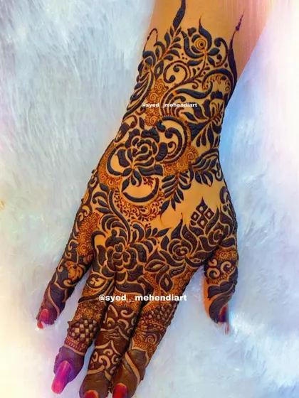 A heavy designer piece with a focus on intricate floral and paisley work.