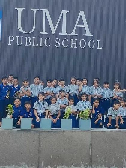 Students and instructors in front of the Uma Public School building, highlighting our strong partnership and integrated campus facilities.