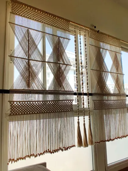This view shows how the macrame partition hangs in front of a window, filtering light beautifully.