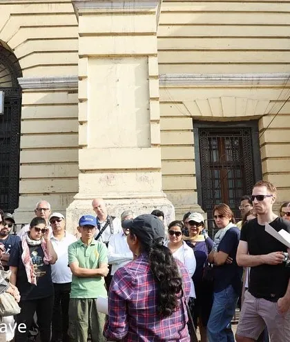 A close-up of a group on the Chandni Chowk walk. I use archival maps and texts to explain the layers of history contained within these colonial-era buildings.