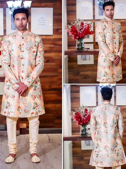 A beautiful patchwork-style floral print sherwani in peach and cream tones. This outfit offers a unique and charming look for any wedding function.