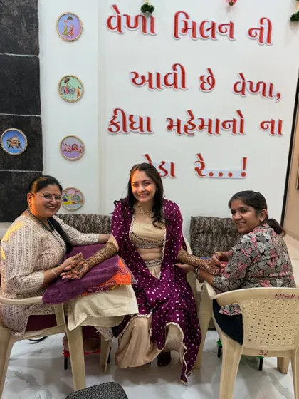 A candid moment during a mehndi session. Here I am with my team member, applying henna for a lovely bride. We always make sure our brides are comfortable and happy.