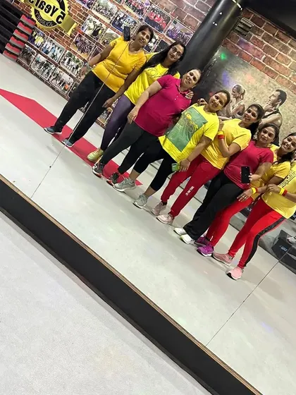Posing by the mirror after our special Rajyotsava class. The reflection shows a group of happy, energetic, and proud members.