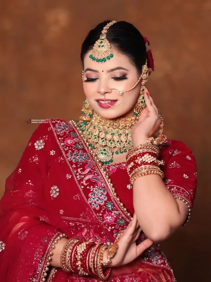 A candid moment that captures the bride's serene beauty. The makeup is set to be flawless through all the emotions of the day.