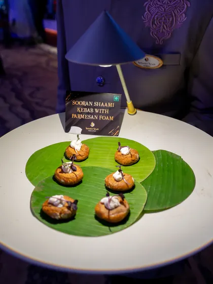 Our Sooran Shaami Kebab with Parmesan Foam, presented on a banana leaf. This innovative vegetarian kebab is a perfect example of our progressive Indian culinary style.