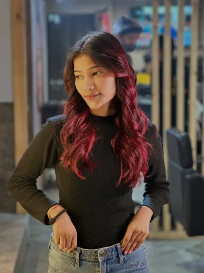 A different angle of this fiery red look, showing how the color blends seamlessly from the darker roots to the bright ends.