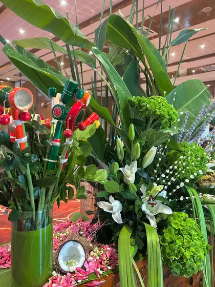 We sourced these traditional wooden toys and integrated them into the floral arrangements, adding a touch of nostalgic charm and personalization.