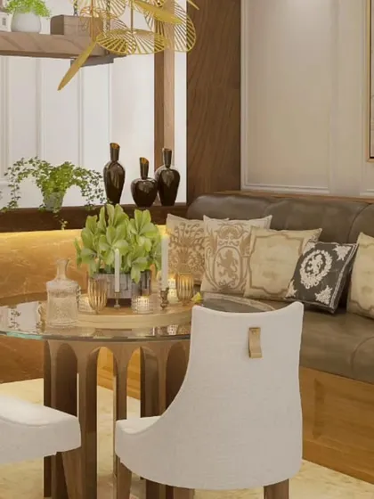 A close-up of the dining table setup, highlighting the glass tabletop, intricate wooden base, and the plush, cushioned banquette seating.