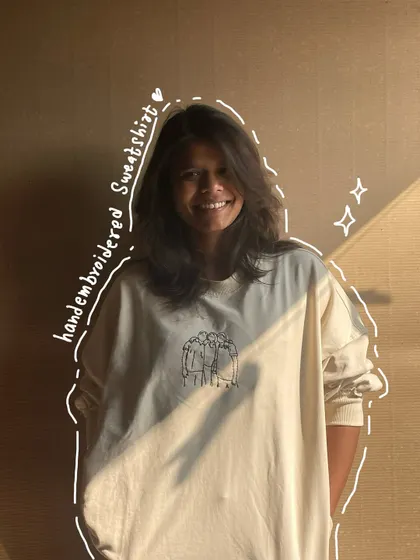 A full look at the custom line art sweatshirt. It's a simple design on the chest, but it holds so much meaning for the person wearing it.
