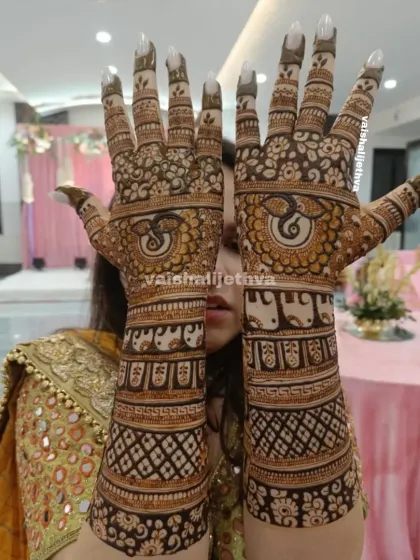 A stunning back-hand design featuring Ganesha and elephant motifs. The intricate patterns and bold figures create a divine and majestic look.