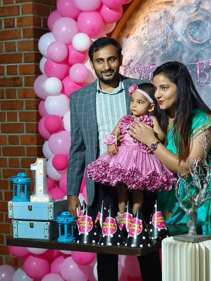 A beautiful family portrait at Mishka's moon-themed first birthday party. My goal is to create a stunning backdrop so you can capture memories that will last a lifetime.
