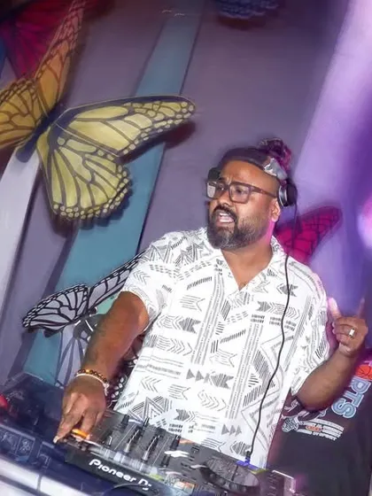 In the mix at a private party, with my VDJ screen displaying visuals in the background. It's not just about the music, it's about creating a complete sensory experience.