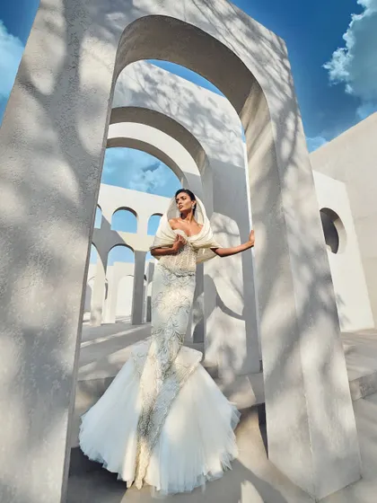 The beginning of my 'Prismatic Symphony' collection. This ivory gown features a sculpted corset and a hooded drape that frames the face like a halo, a harmony of form and movement.