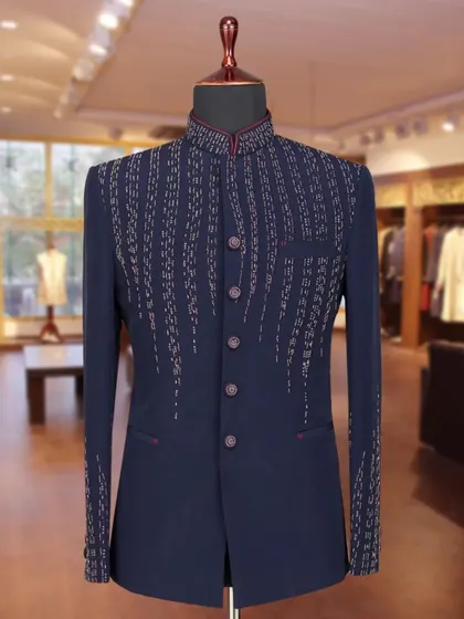 A navy blue Jodhpuri with linear, cascading beadwork. This design creates a slimming effect and adds a touch of modern sparkle.