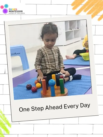 One step ahead every day. This child is engaged with a ring stacker, an activity that enhances fine motor skills, color recognition, and the ability to sort objects by size.