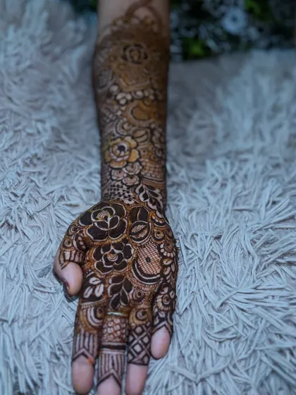 A single arm view of the semi-bridal design, showing how the patterns complement the personalized initial.