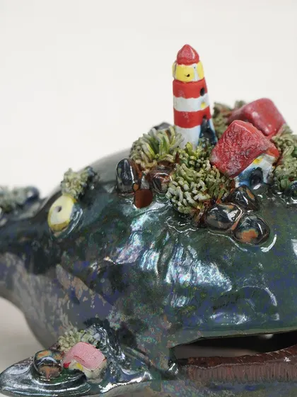 A sneak peek of the composite forms created in our Miniature Workshop. These whimsical pieces, like a whale with a lighthouse on its back, show how combining small elements can create a magical, narrative sculpture.