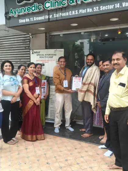A group photo with the team and dignitaries at the health camp. It takes a collective effort to organize such events and spread awareness about holistic health.