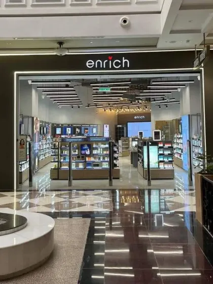 The storefront we designed and executed for Enrich, a major salon and beauty brand. A strong facade is crucial for retail, and we focused on creating an inviting, premium entrance with clear branding and excellent lighting that draws customers in.