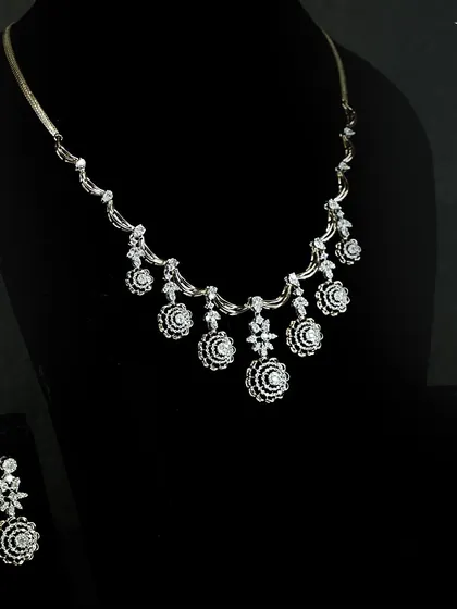 When the occasion calls for grace and beauty, this set is the answer. Designed with dainty floral diamonds and soft golden accents, it is made for moments you will cherish forever.