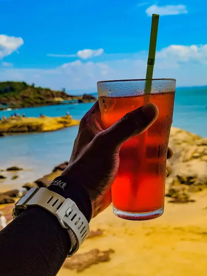 A refreshing drink with a beach view. It's the small moments of relaxation that make a corporate offsite truly special.