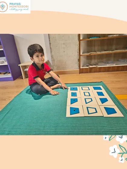 Concentration and precision are key as this student works with the geometric insets, a foundational activity for mathematics and writing.
