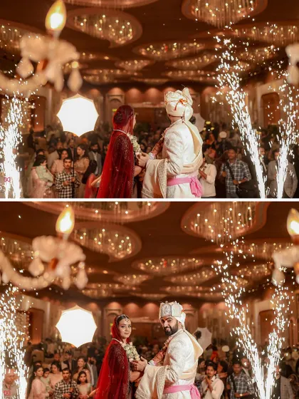 The Varmala ceremony in a grand ballroom, with the couple framed by sparklers, creating a spectacular and memorable wedding moment.