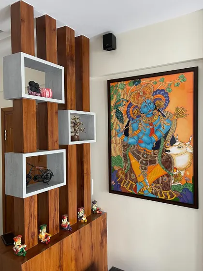 The Krishna mural fits perfectly into the decor, adding a touch of traditional elegance and spiritual warmth to the room.