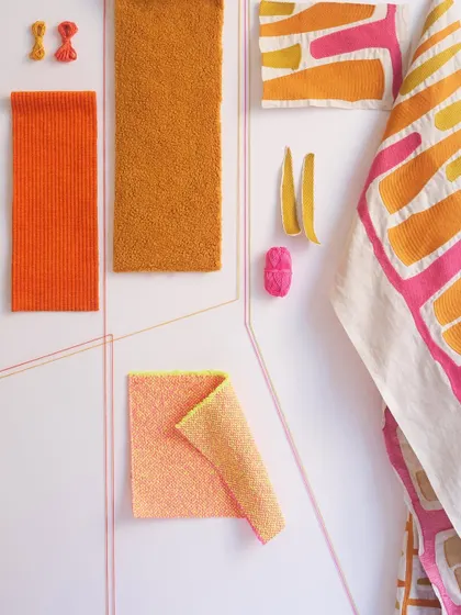 A mood board featuring vibrant fabrics from Élitis. The combination of bold geometric embroidery, bright colors, and varied textures creates a playground of expressive artistry.