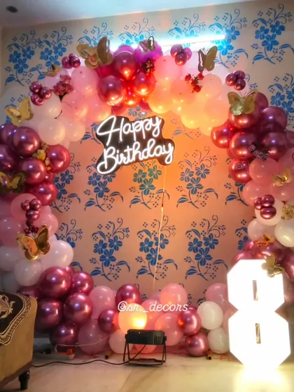 A different lighting view of the fairy theme, showing how colored uplighting can change the mood of the party decor.