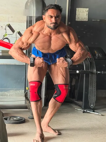 Another most muscular pose, showing the quad separation.