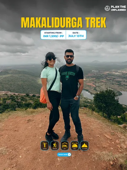A couple posing on the Makalidurga trek, a perfect quick getaway from Bangalore.