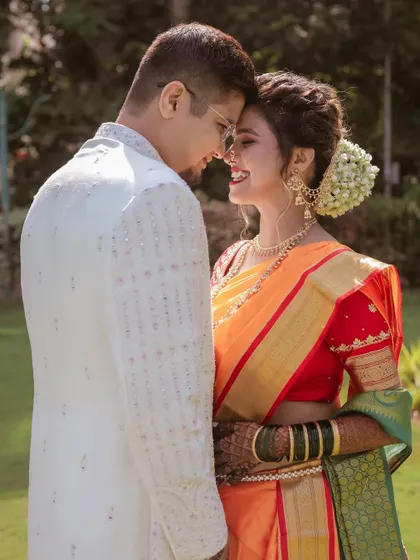 A sweet, candid moment between this Maharashtrian couple. We love capturing the natural smiles and loving glances they share.