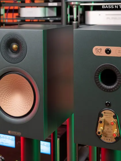 The front and back of the Monitor Audio Silver 100 7G, highlighting the C-CAM gold dome tweeter and the rear-ported design for improved bass response.