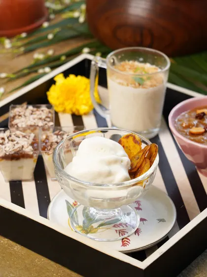 A dessert platter from one of our pop-ups, showcasing the variety of sweets I offer. You can see a modern take on tender coconut ice cream, payasam shots, and other inventive treats.
