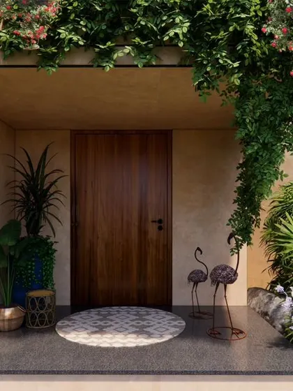 The entrance porch of the Earth Abode, where climbing plants and lush landscaping welcome you into the home.