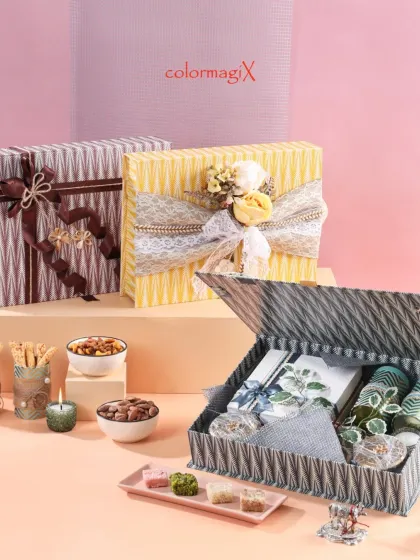 An open view of our textured gift box, revealing a thoughtfully arranged selection of items inside. We focus on both the exterior presentation and the quality of the contents.
