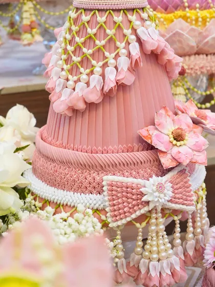 An incredibly detailed, handcrafted floral structure used as decor for the wedding ceremony. This level of artistry and craftsmanship is a hallmark of our design philosophy.