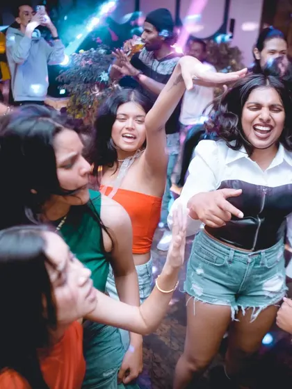The dance floor packed with people losing themselves to the beat.